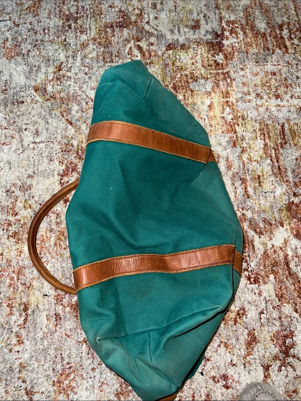 Vintage green duffle bag with leather handles